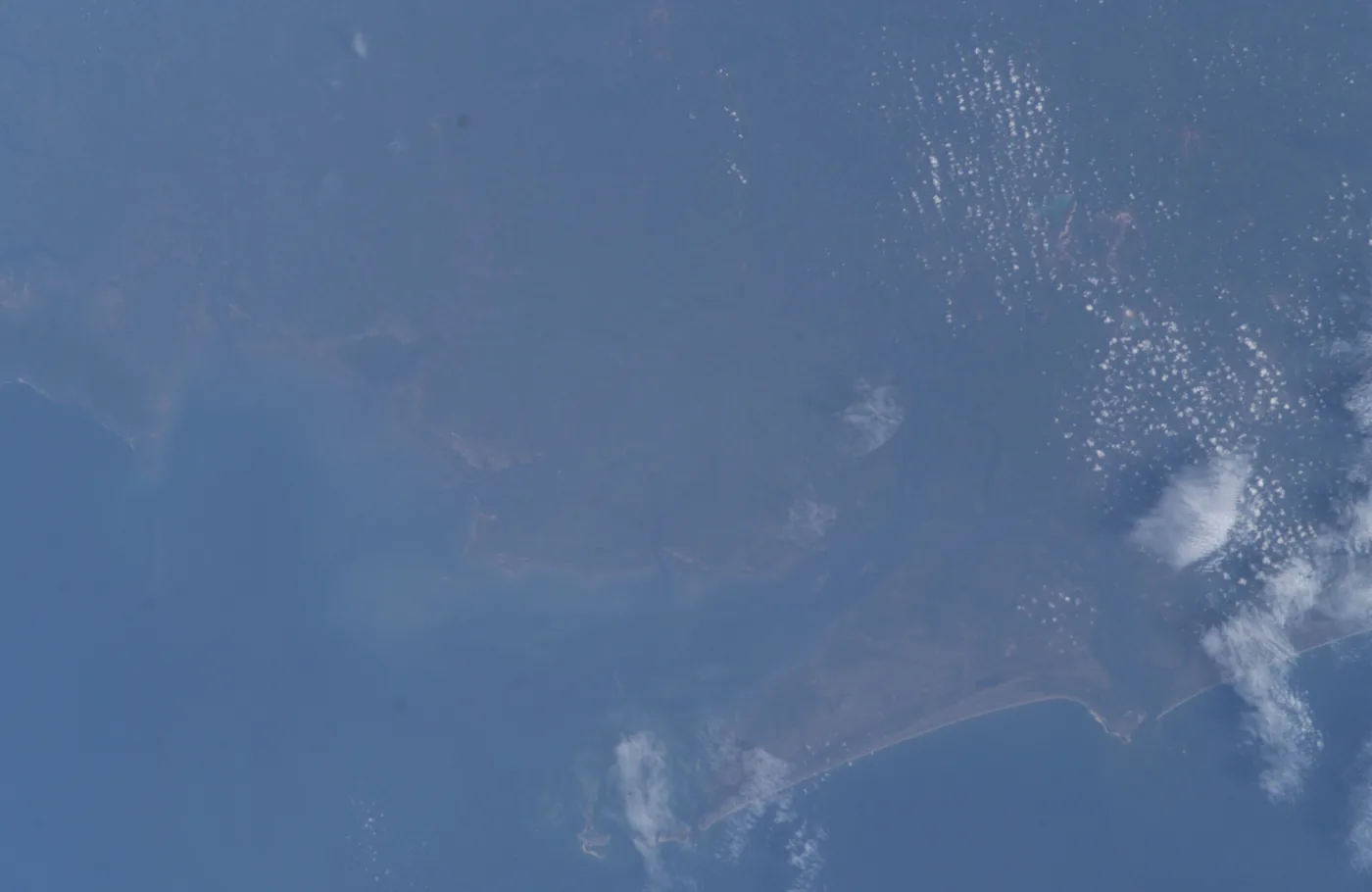 The Atlantic coastline of Sierra Leone in light haze, seen from the International Space Station